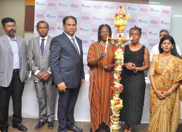 The Ugandan Ambassador to India Ms. Grace Akello lights a traditional lamp to inaugurate the International Women's Day Celebrations at the 'Naruvi Hospitals'