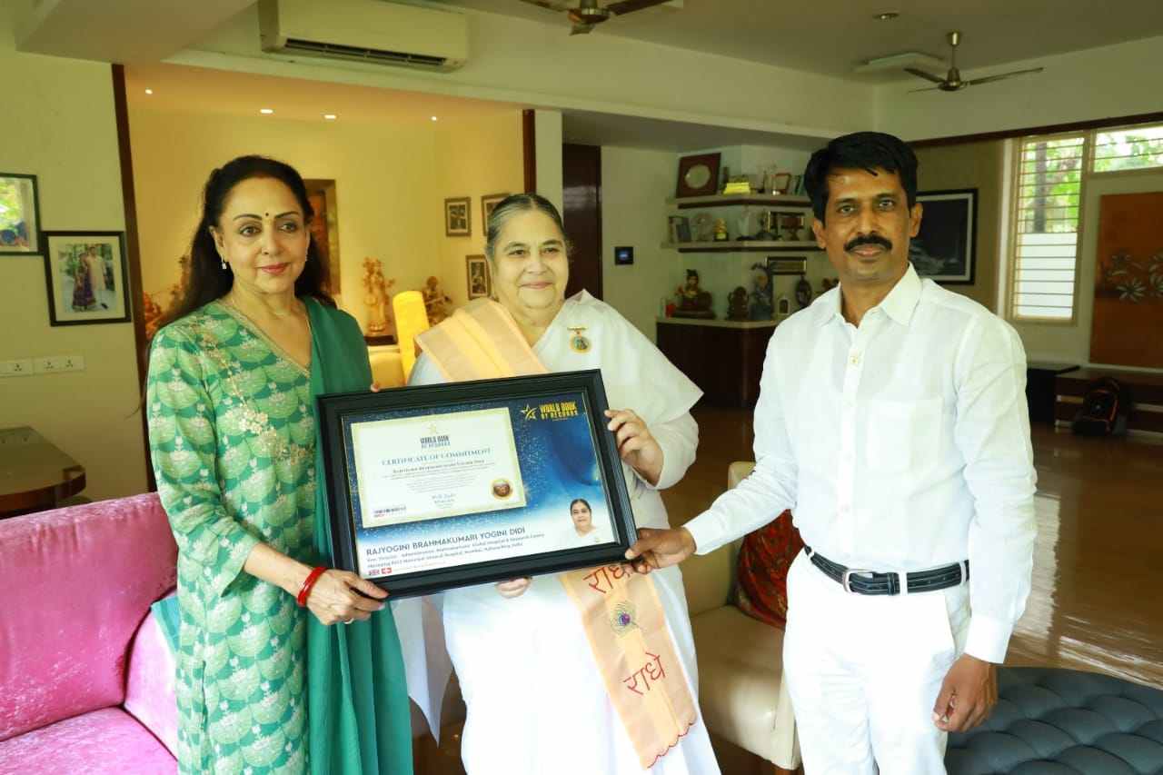 Honourable Hema Malini bestows the certificate of Commitment (Switzerland) to Rajyogini Brahmakumari Yogini Didi